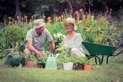 Gardener inspecting a Southfields garden with tools and clipboard